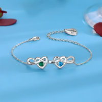 Personalized engraved heart bracelet with custom name and birthstone, featuring a delicate chain in silver